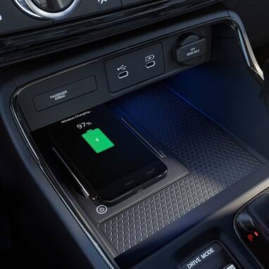 2027 Honda CR-V detail of the wireless phone charging pad and USB-C ports (Compact Crossover SUV).