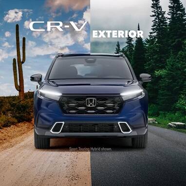 2027 Honda CR-V in Canyon River Blue Metallic front split between desert and forest road (Compact Crossover SUV).