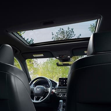 2027 Honda Civic Hatchback Sport Touring Hybrid interior detail of the power moonroof and overhead console (Compact Hatchback).